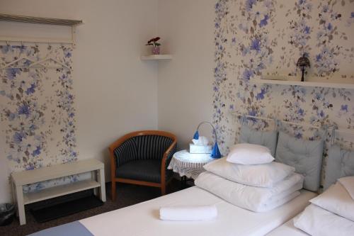 Ένα ή περισσότερα κρεβάτια σε δωμάτιο στο Kolorowa Guest Rooms