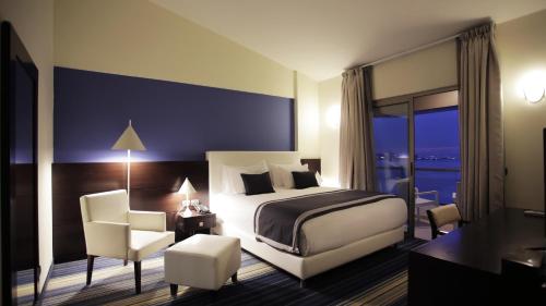 Voodi või voodid majutusasutuse Monte Mare Hotel toas