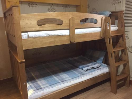 a couple of bunk beds in a room at K Motel in Daegu