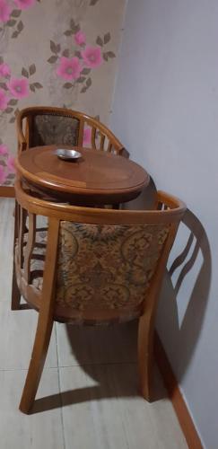 a wooden chair with a table on top of it at K Motel in Daegu