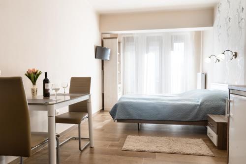 Postel nebo postele na pokoji v ubytování RÁBA Apartman
