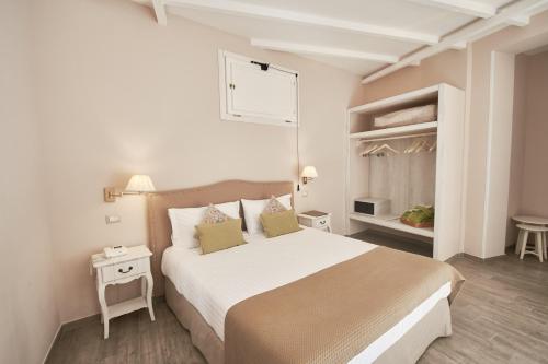 Katil atau katil-katil dalam bilik di Cas'E Charming House