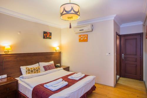 Postel nebo postele na pokoji v ubytování Berce Apartments