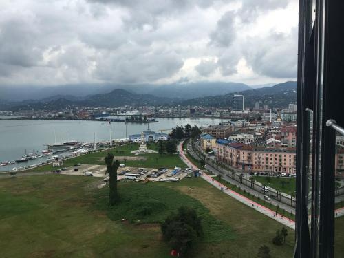 a view of a city with a river and a city at Premium apartment in Porta Batumi Tower in Batumi