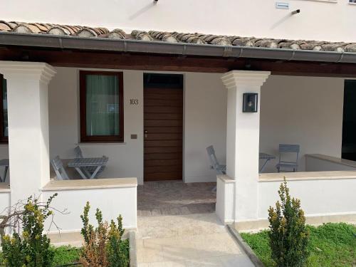 a house with a porch and a patio at Favilla Hotel di Charme in Rome