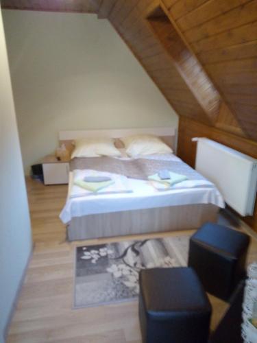 a bedroom with a bed in a attic at Casa VIO in Sighişoara