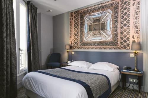 Ένα ή περισσότερα κρεβάτια σε δωμάτιο στο Hotel Saint Christophe