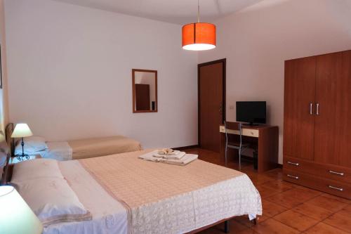 Postel nebo postele na pokoji v ubytování B&B Ulisse
