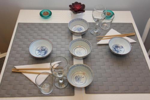 a table with plates and glasses on a table at The Viking Country Club in Hjalteyri