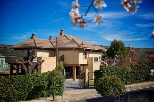 a house with a shingled roof at Villa Castro in Nuévalos