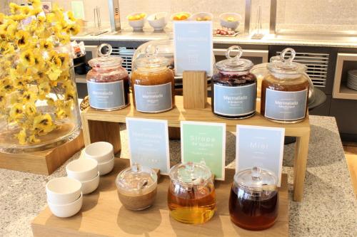 a display of jars of honey on a table at Barceló Ourense in Ourense