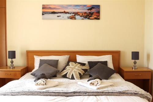 a bedroom with a bed with towels on it at Villa Luka in Pag
