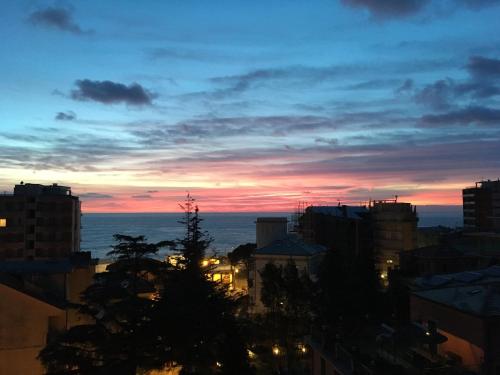 a view of a city at sunset at Tino Brezza di Mare in Deiva Marina