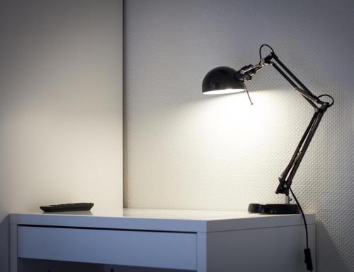 a black lamp sitting on top of a white dresser at Hotel Krone Zentrum in Vaihingen an der Enz