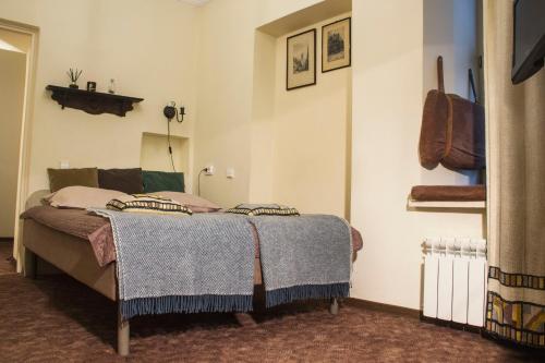 Ein Bett oder Betten in einem Zimmer der Unterkunft Mini Home Vilnius Old Town