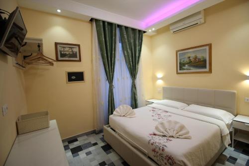 Postel nebo postele na pokoji v ubytování Quest House Lihong