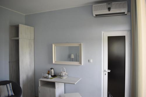 a room with a black door and a mirror at Синя луна in Lozenets