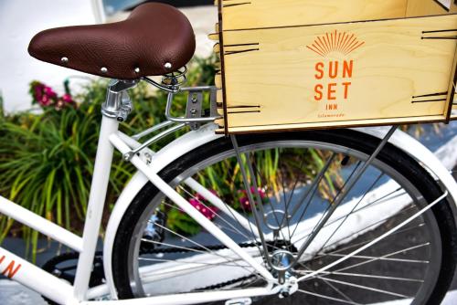 a white bike with a box on the front wheel at Sunset Inn in Islamorada