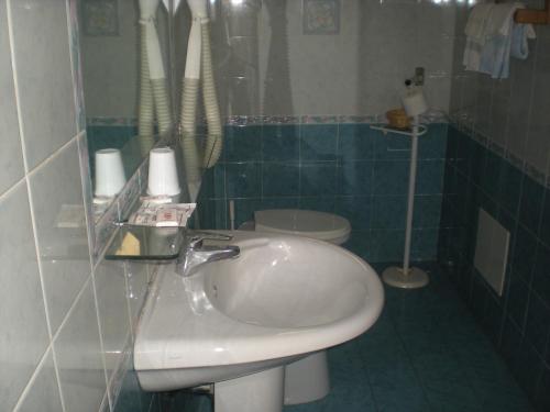 a bathroom with a sink and a toilet at Hotel Gentile in Agerola
