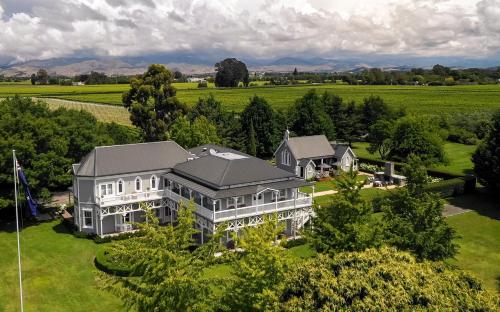 an aerial view of a large house in a field at The Marlborough in Blenheim