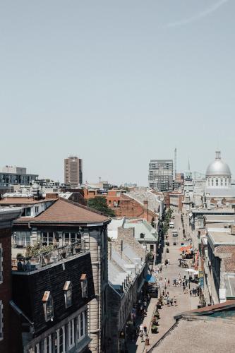 a view of a city street with buildings at Lofts du Vieux-Port by Gray Collection in Montréal