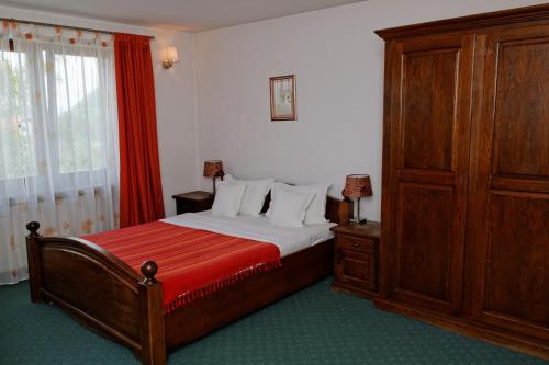 Кровать или кровати в номере Pension Stejeris