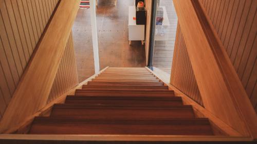 a staircase leading up to a room with wooden floors at La Uruguaya in Ocean Park