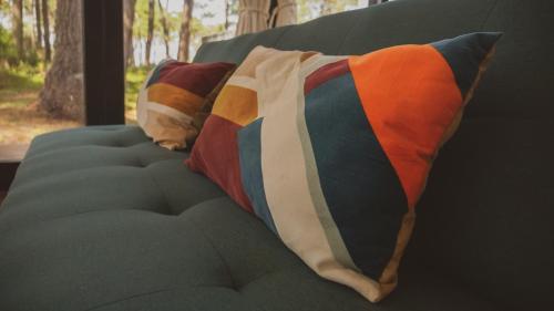 a pillow sitting on top of a couch at La Uruguaya in Ocean Park