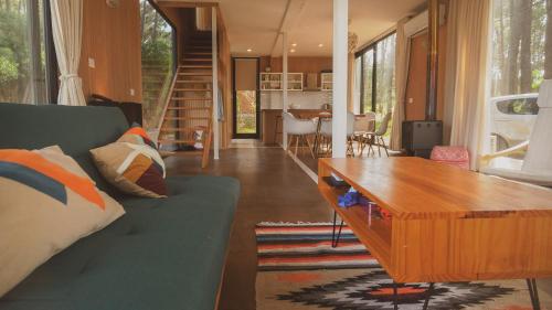a living room with a couch and a wooden table at La Uruguaya in Ocean Park