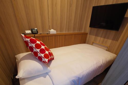 
A bed or beds in a room at Hotel Nanpuro
