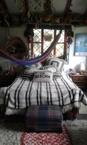 Postel nebo postele na pokoji v ubytování Casa de piedra El Colibrí