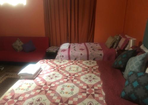 Кровать или кровати в номере Globe Guesthouse