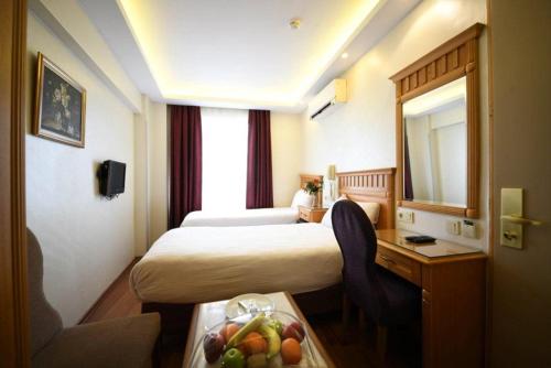 Cama o camas de una habitación en Park Star Hotel Taksim