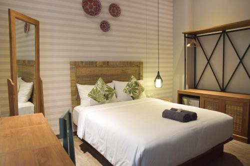 מיטה או מיטות בחדר ב-Grhatama Guest House