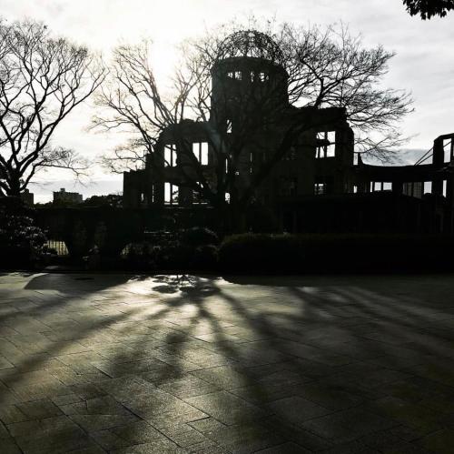 a silhouette of an old building with trees in the background at Guesthouse POPTONE in Hiroshima