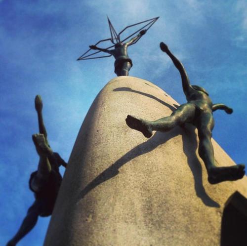 a statue of people on top of a tower at Guesthouse POPTONE in Hiroshima
