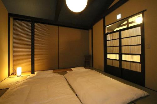 Säng eller sängar i ett rum på Chizuruan
