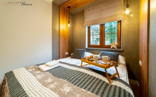 Posteľ alebo postele v izbe v ubytovaní Wonder Home - Apartamenty w zielonej okolicy, blisko centrum Karpacza