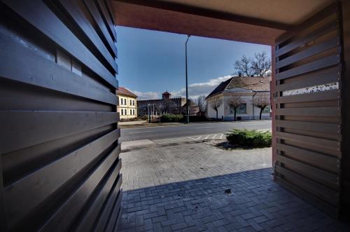 a view of a street from a building doorway at Royal Residence Apartments in Gyula