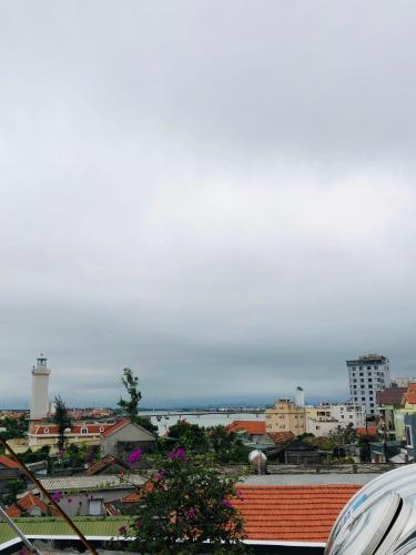 a view of a city with buildings and a sky at Peaceful House Hostel in Dong Hoi