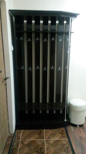 a bathroom with a black shower stall next to a toilet at Квартира 2-ух комнатная в центре города in Fergana