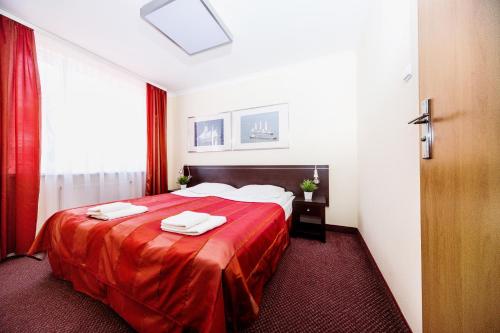 מיטה או מיטות בחדר ב-Resort Plaza Spa