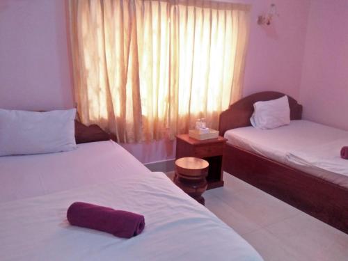 Postel nebo postele na pokoji v ubytování Sam So Guesthouse