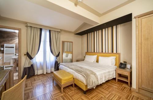 a bedroom with a bed and a large window at Solo Experience Hotel in Florence