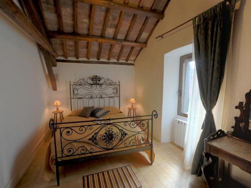 a bedroom with a bed with two lamps on it at Historic house in Montefiascone