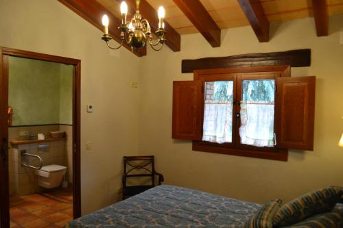Кровать или кровати в номере Country House El Permanyer