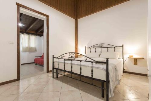 a bedroom with a bed in a room at Eloka in Torre Squillace
