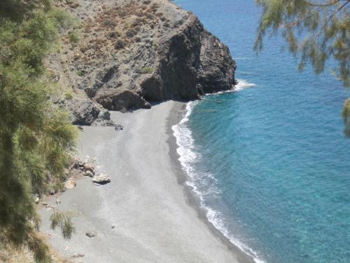 a view of a beach next to the ocean at Sfinias Apartments in Kali Limenes