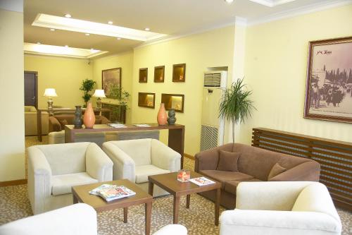 a waiting room with couches and chairs and tables at Arma Hotel in Manisa