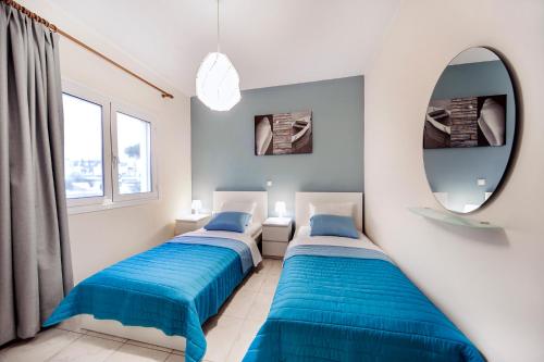 Postel nebo postele na pokoji v ubytování Omega Comfy Apartments